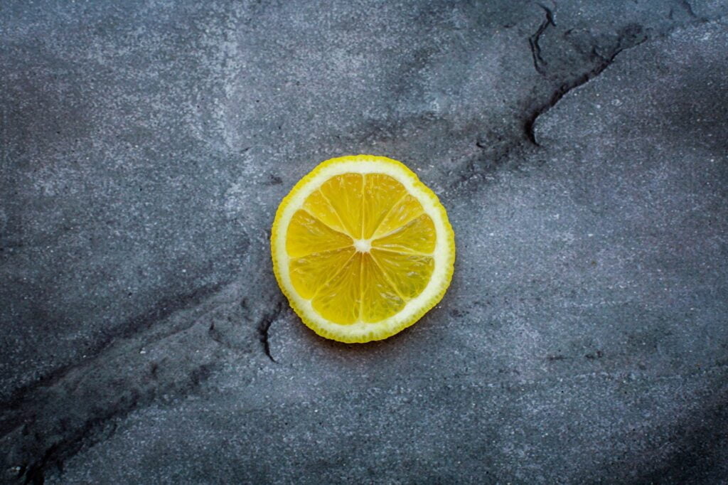 lemon slice on gray cracked surface